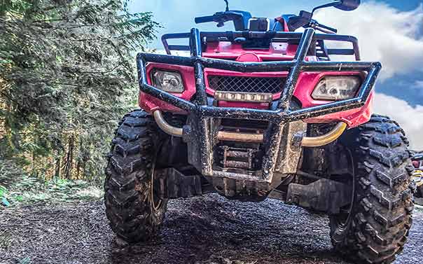 muddy red ATV