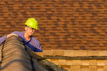 a roof professional checking a roof