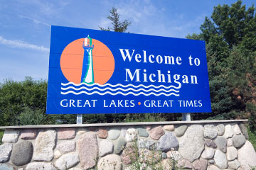 A blue welcome to Michigan road sign